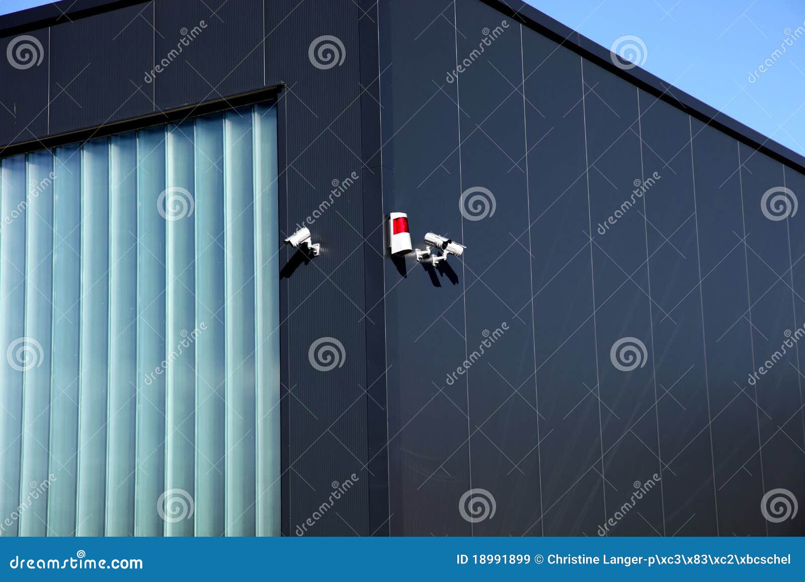 Surveillance Camera and Alarm System on a Building Stock Image Image