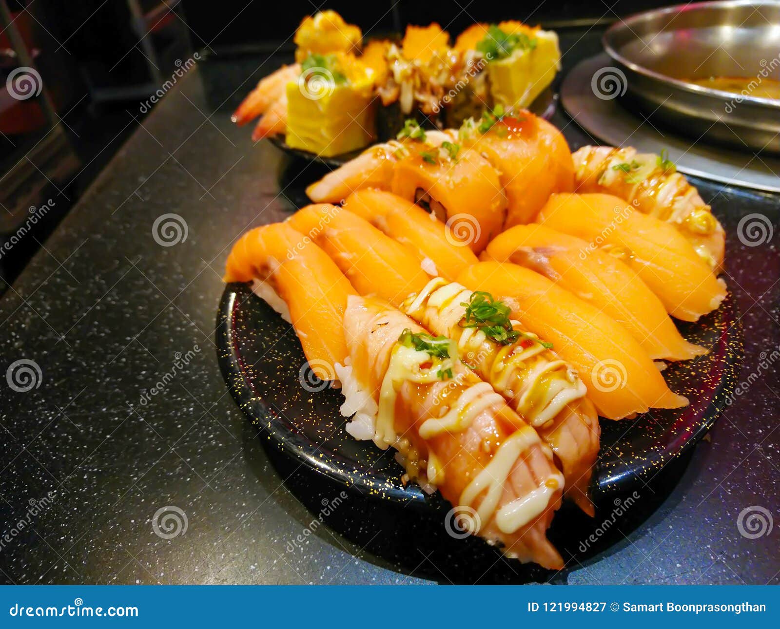 Sushi on the black plate. stock image. Image of closeup 121994827