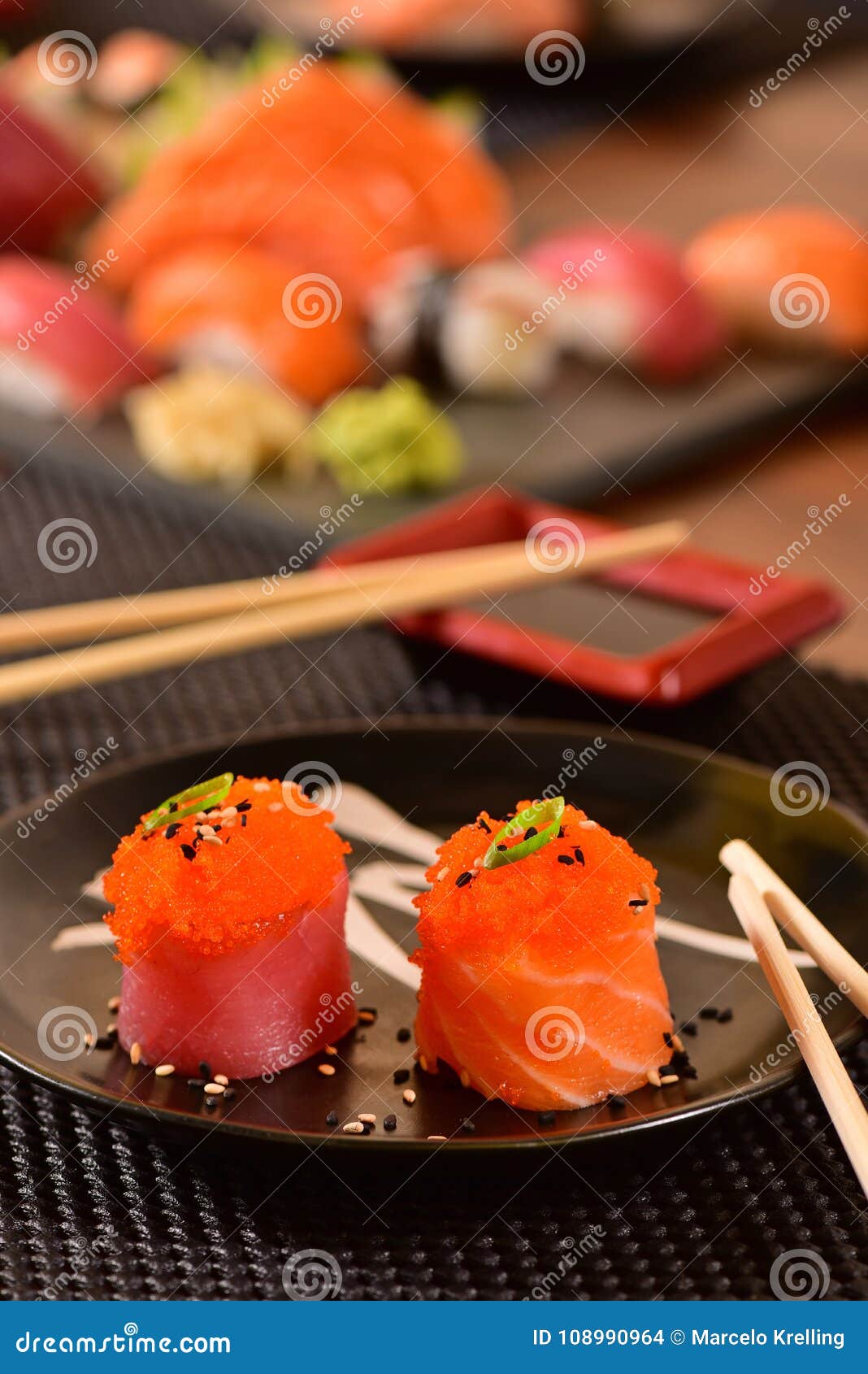 Salmon and fish eggs sushi stock photo. Image of black 108990964