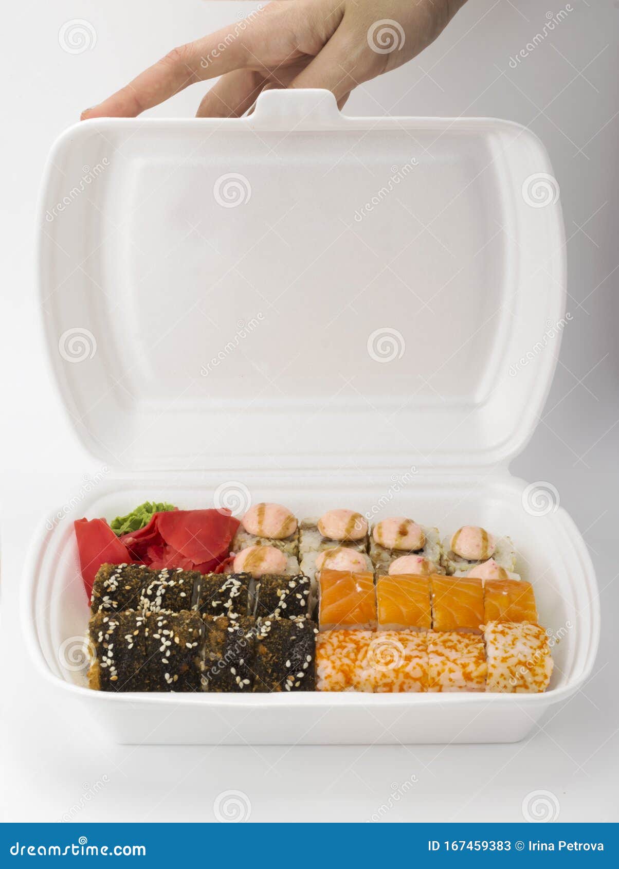Sushi Delivery at Home . Sushi Packed with Ginger and Wasabi Stock