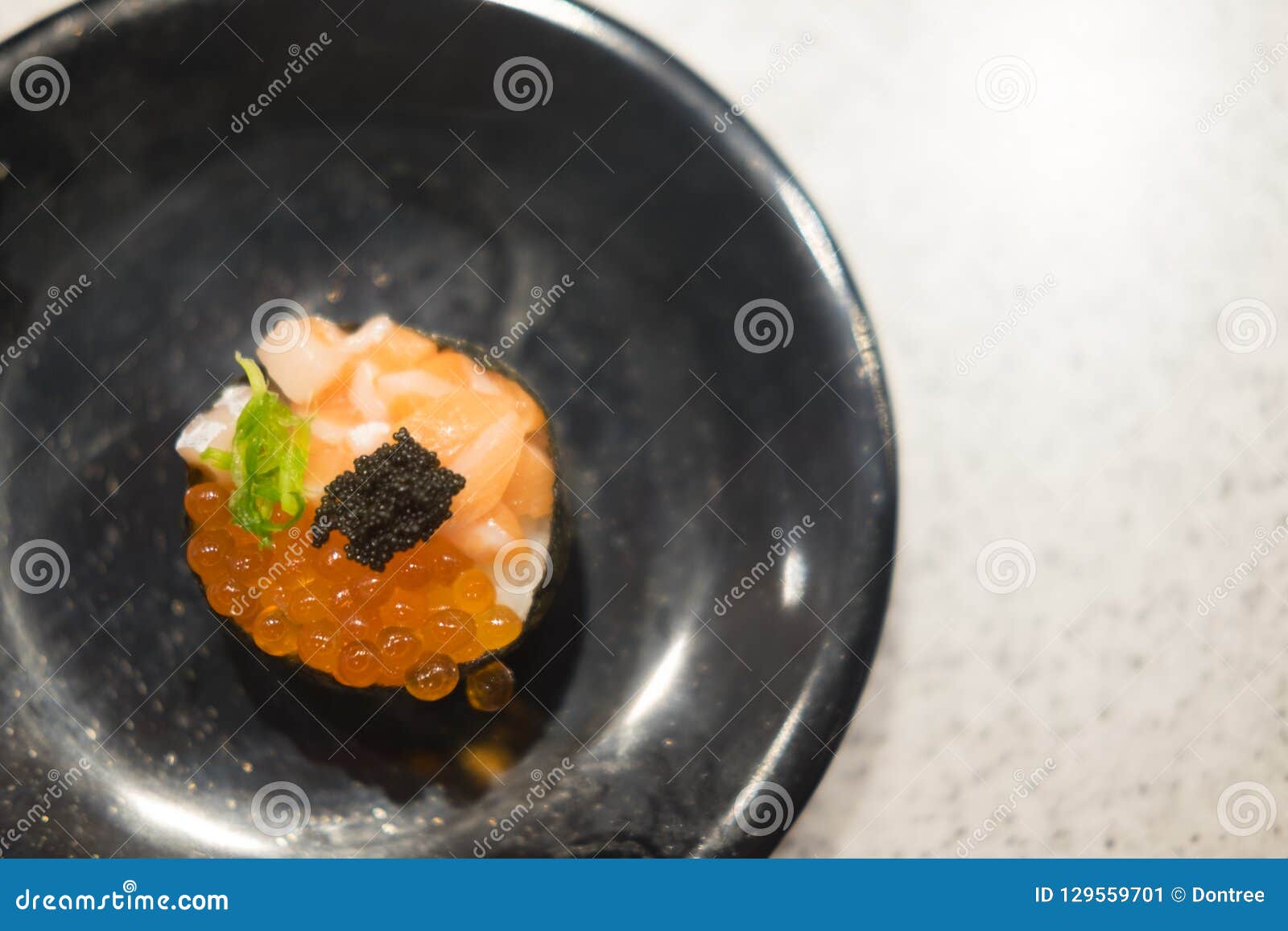 Sushi roll with Salmon Roe stock image. Image of rice 129559701