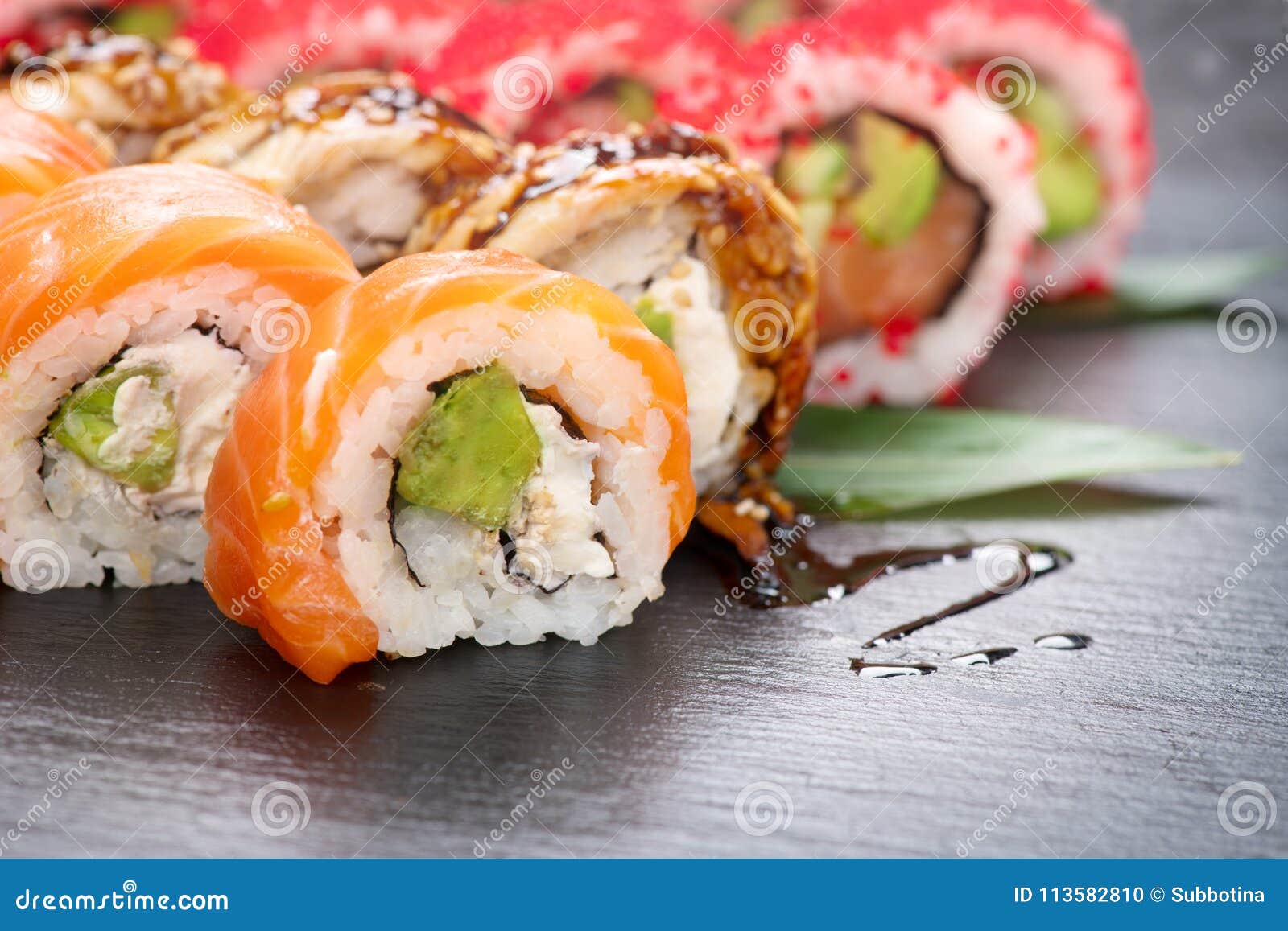 https://thumbs.dreamstime.com/z/sushi-rolls-closeup-japanese-food-restaurant-california-roll-set-salmon-eel-vegetables-flying-fish-caviar-black-113582810.jpg