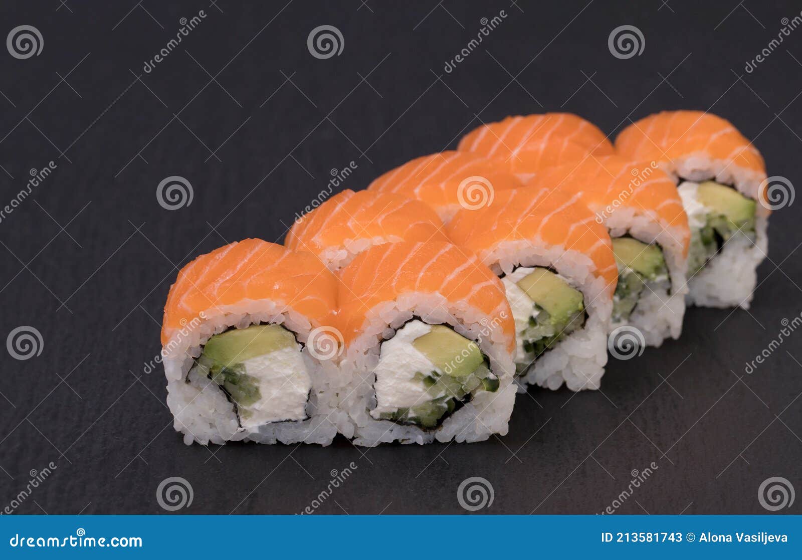 sushi rolls philadelphia maki wiwth rice, salmon, cream cheese, cucumber and avocado