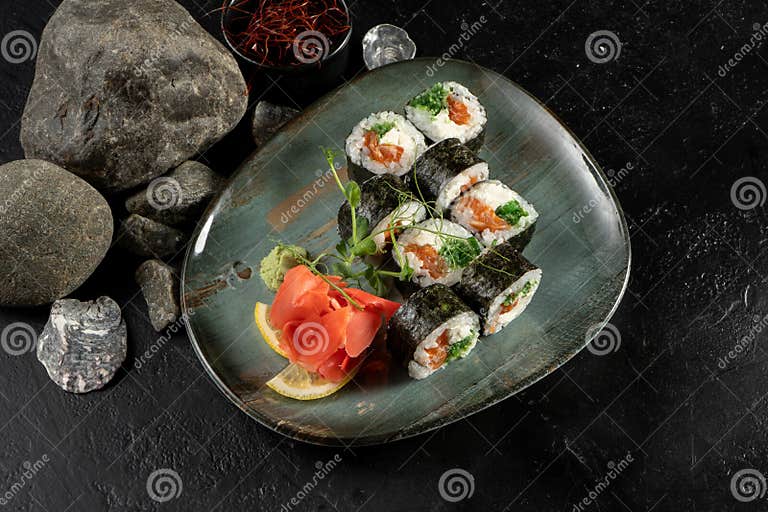 Sushi Rolls with Salmon and Chuka Salad. Stock Image - Image of ginger
