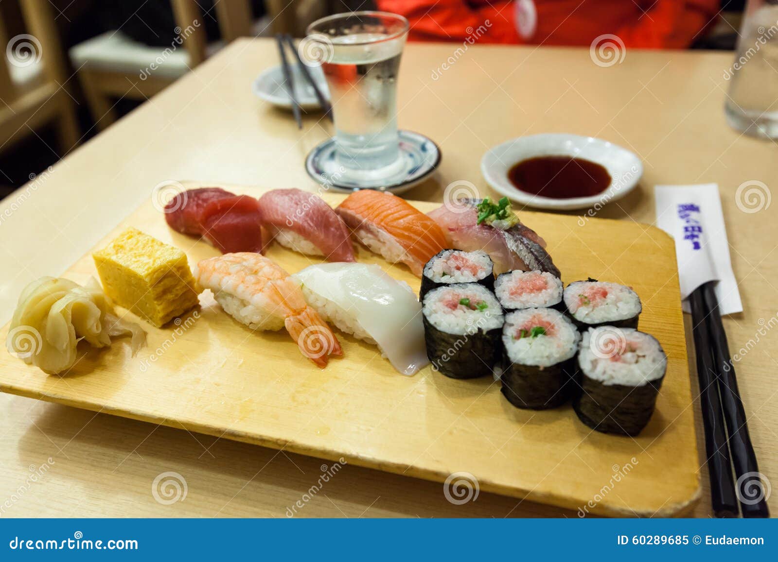 Sushi set menu with sake editorial image. Image of sushi 60289685