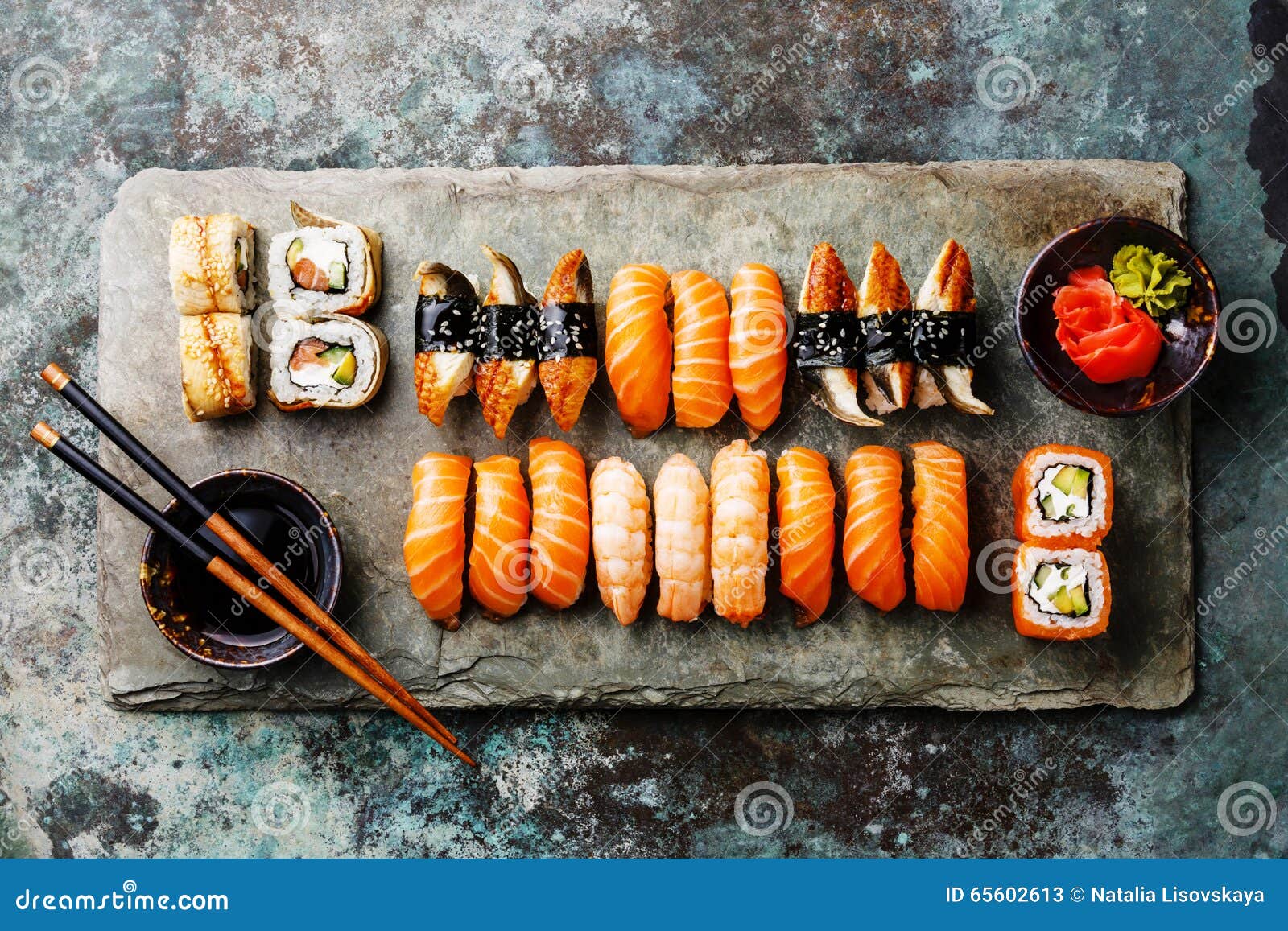 Sushi Set on stone slate stock image. Image of rolls 65602613
