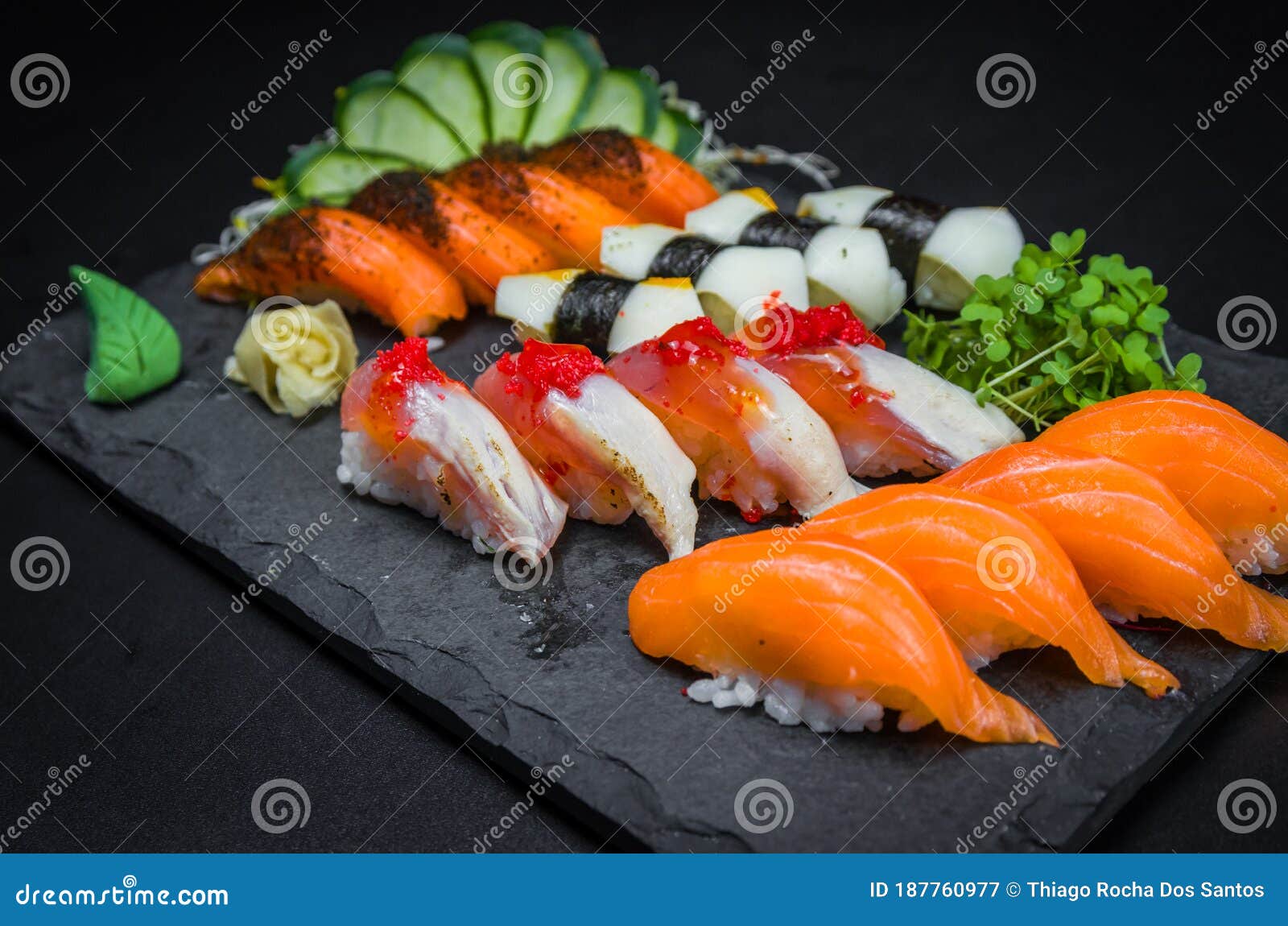 sushi, traditional japanese cuisine. several delicious sushi on the decorated plate, black background. group of sushi, urakami,