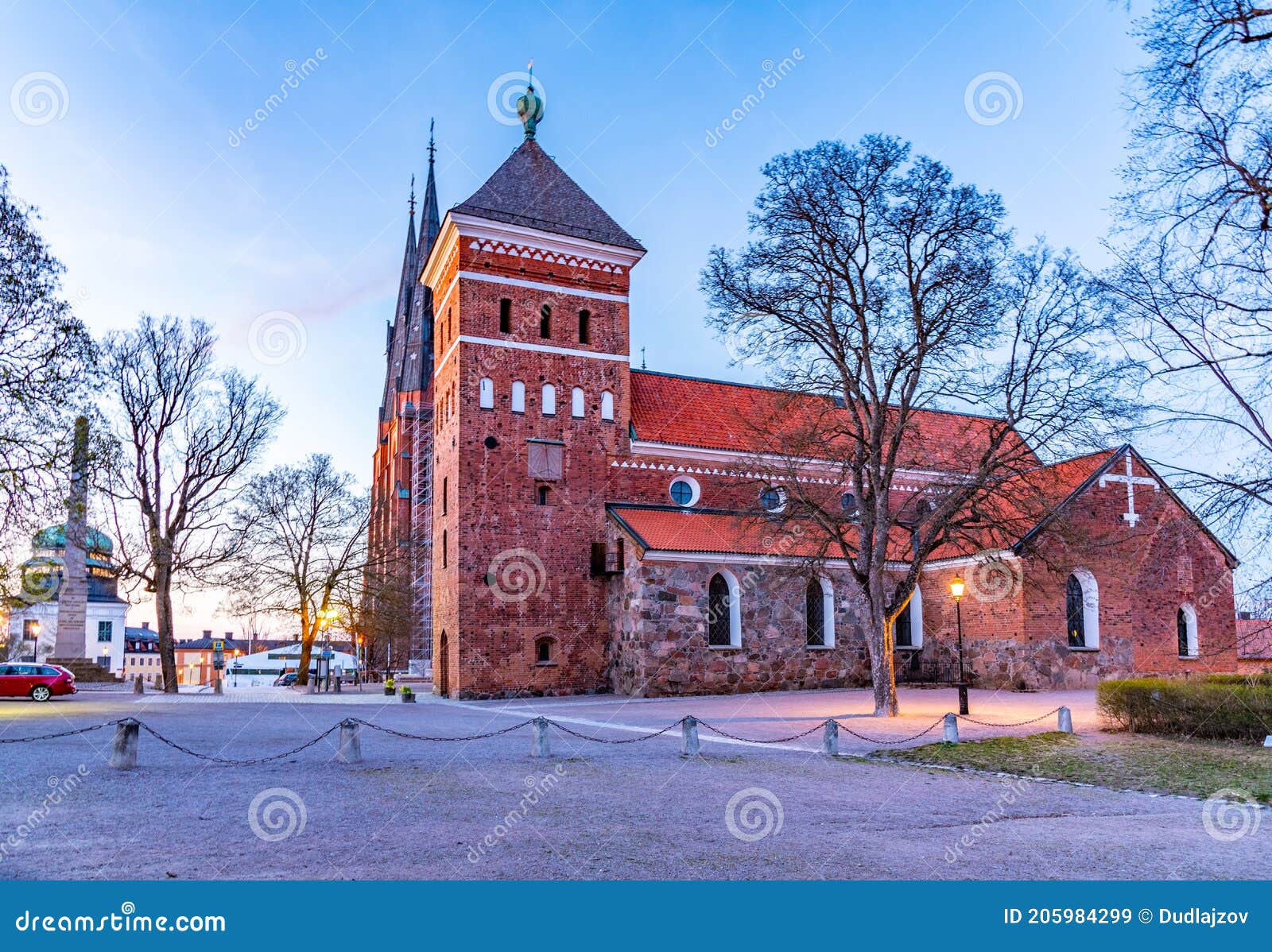 susnset view of helga trefaldighets kyrka and cathedral in uppsala, sweden