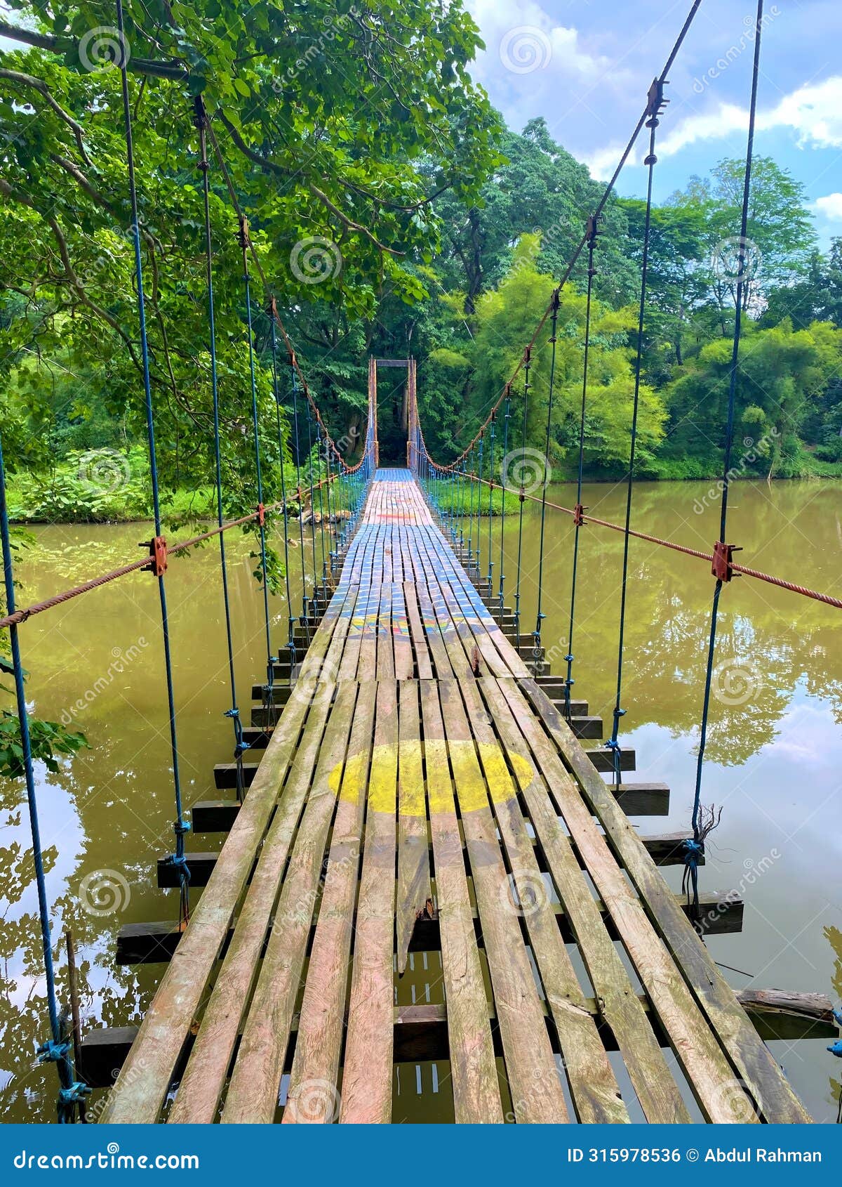a suspension bridge over a river connects two lands