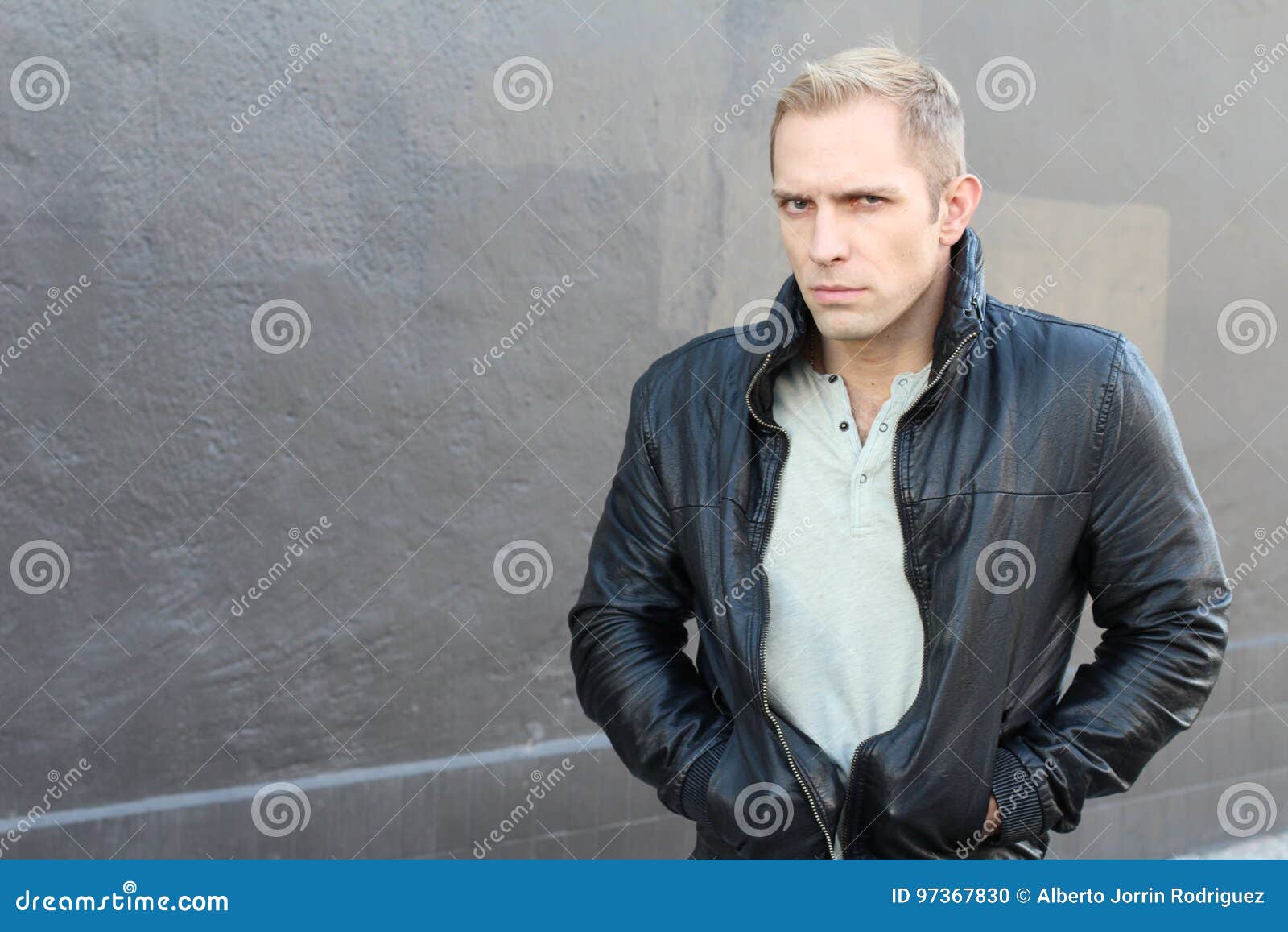 suspicious blond man with an expression of fear and mistrust