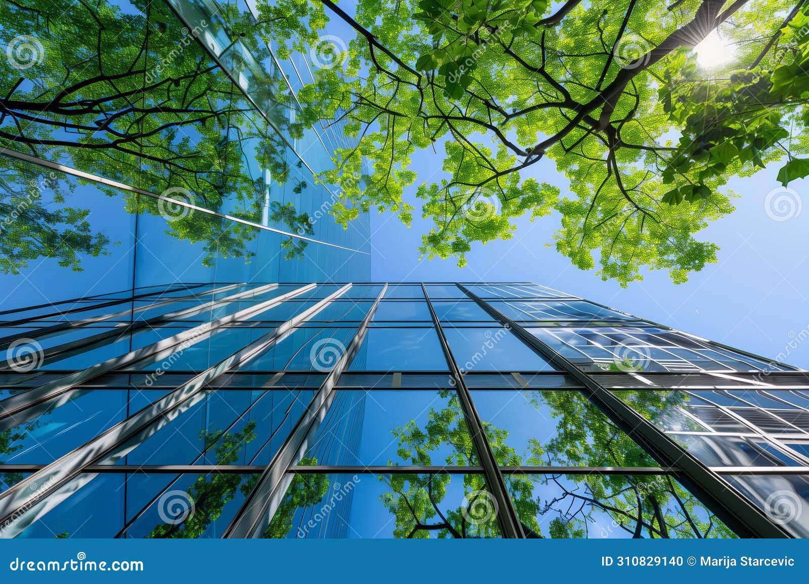 sustainble green building. eco-friendly building. sustainable glass office building with tree for reducing carbon