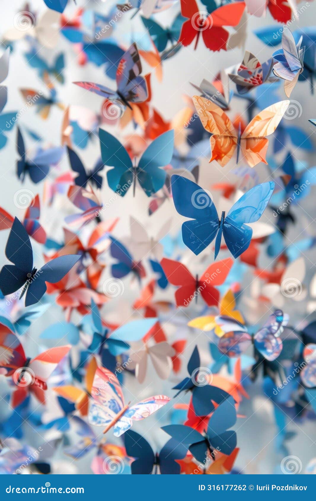 a swarm of paper butterflies flutter in the air, creating a beautiful pattern