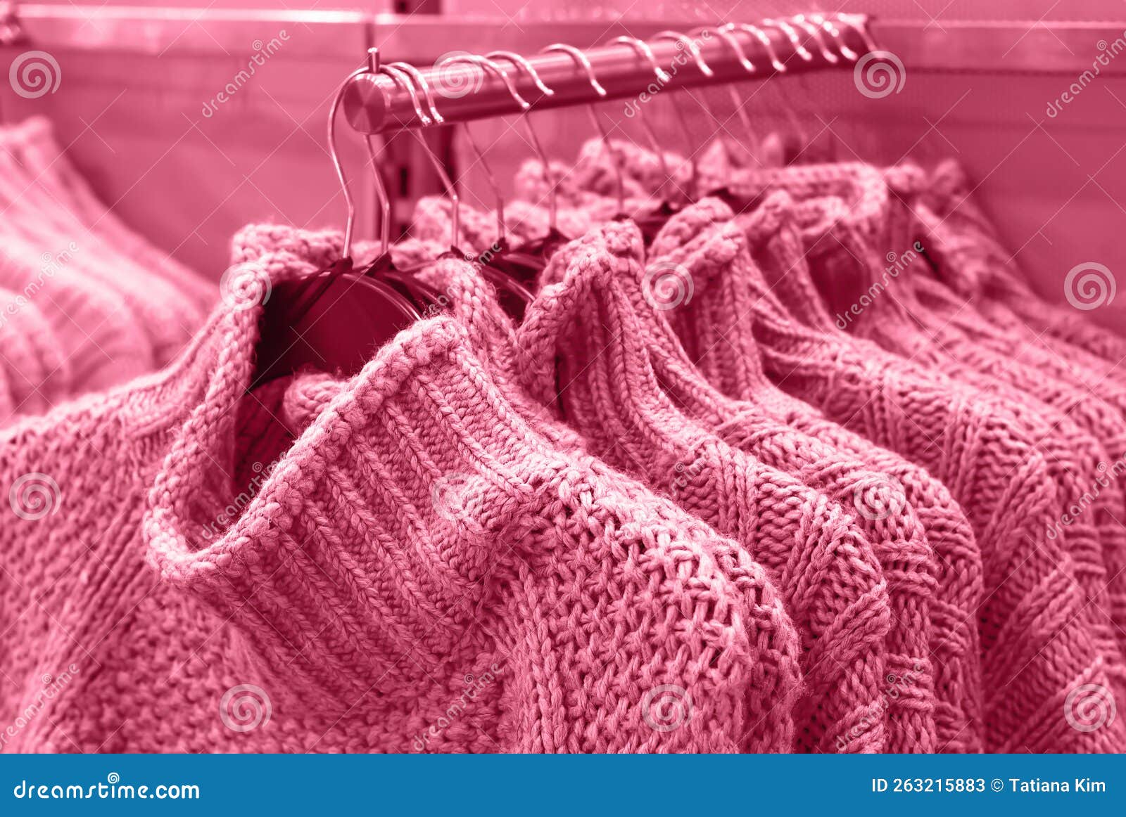 Sweaters on Hangers in Store, Concept Color of Year 2023. Editorial