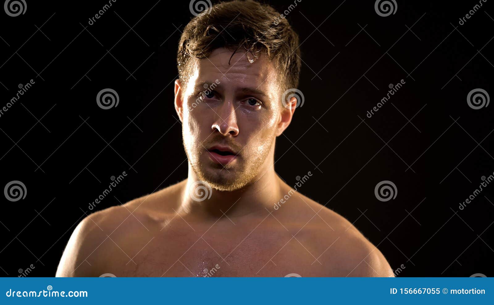 sweaty male boxer hardly breathing after exhausted training, professional sport