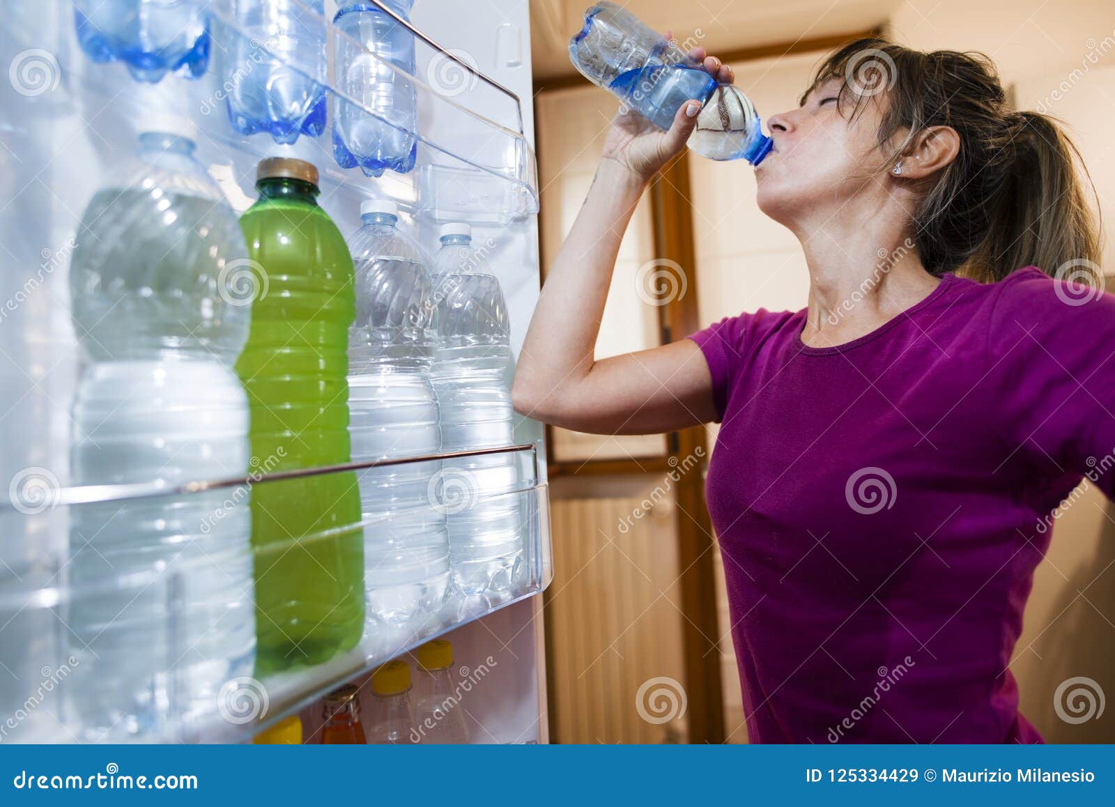 https://thumbs.dreamstime.com/z/sweaty-woman-drinking-water-seen-inside-fridge-sweaty-woman-drinking-water-point-view-inside-open-fridge-125334429.jpg