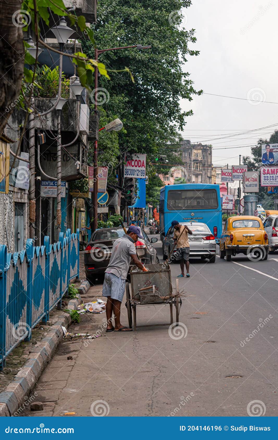 A Sweeper Sweeps the Street of Kolkata, India on October 2020 Editorial