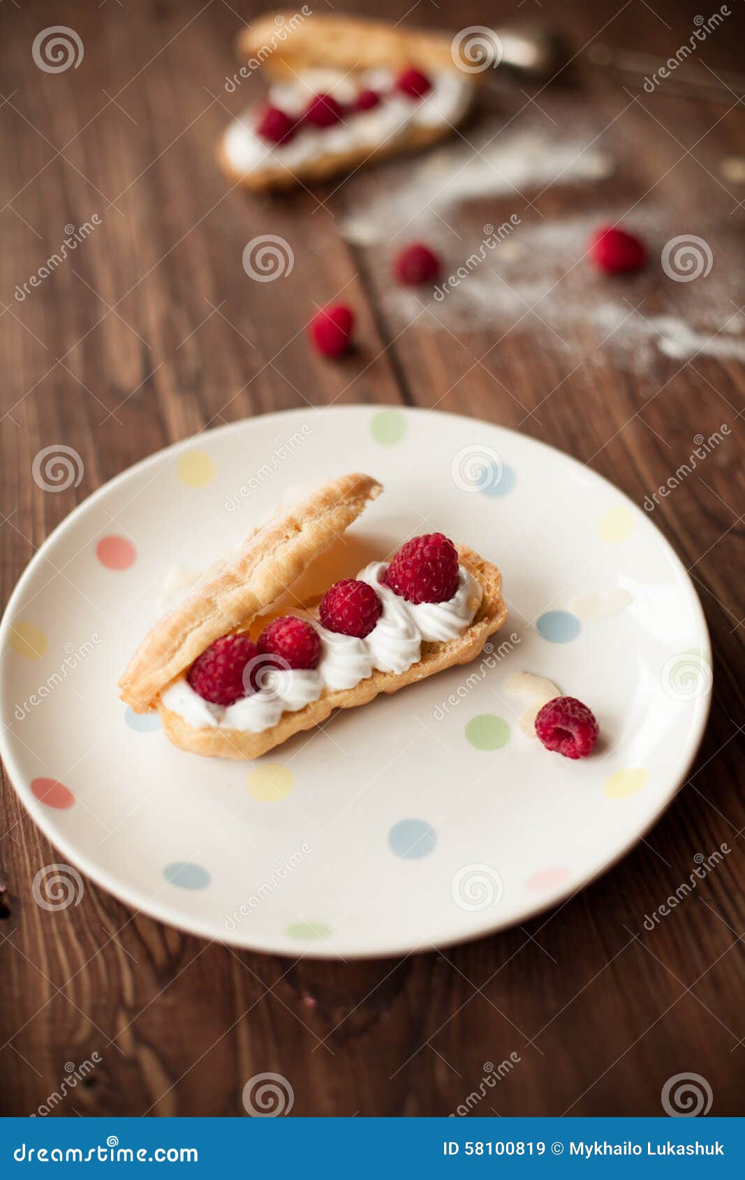 sweet afters with fresh raspberries on wood table