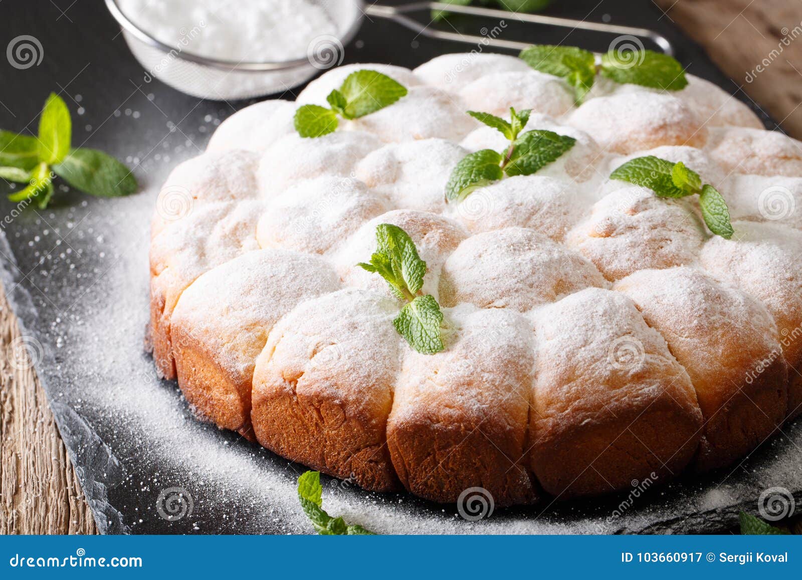 sweet austrian rolls buchteln with powdered sugar close-up. horizontal