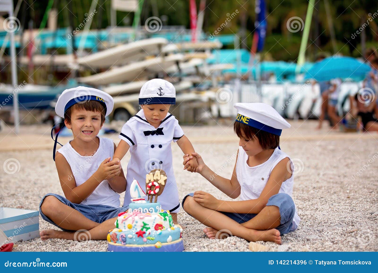 Sweet Baby Boy And His Brothers Celebrating First Birthday With Sea Theme Cake And Decoration Stock Photo Image Of Beach Decorated 142214396
