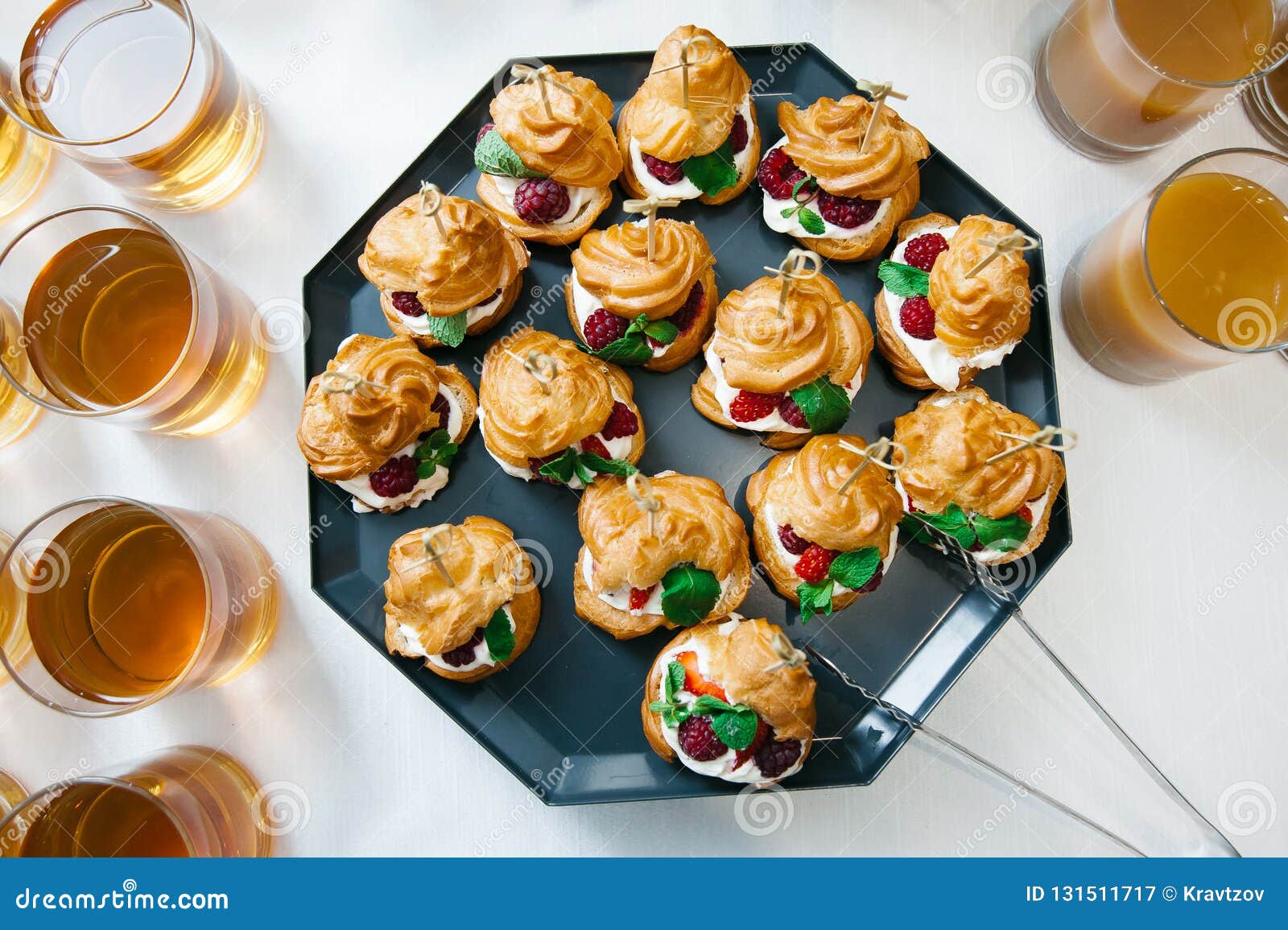 Sweet Catering with Berry Cackes and Juice at White Table Stock Image