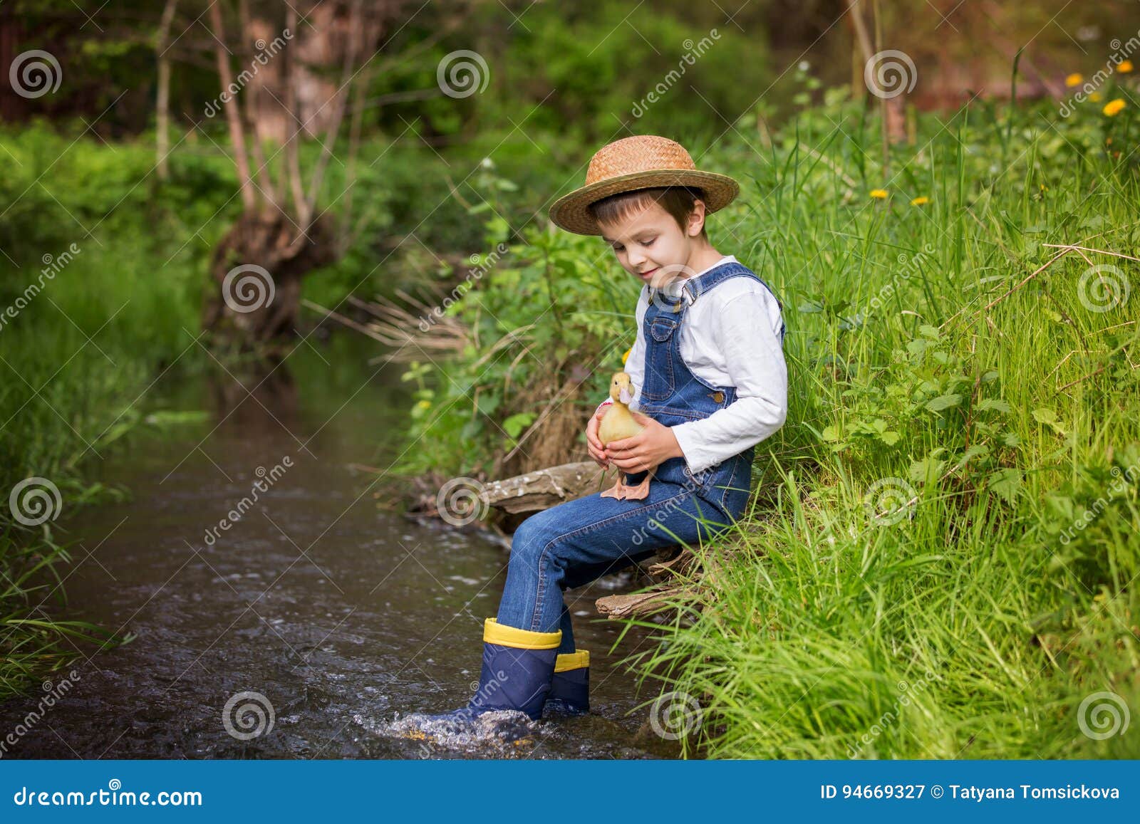 Sweet Child, Playing on Little River with Ducklings Stock Image - Image ...