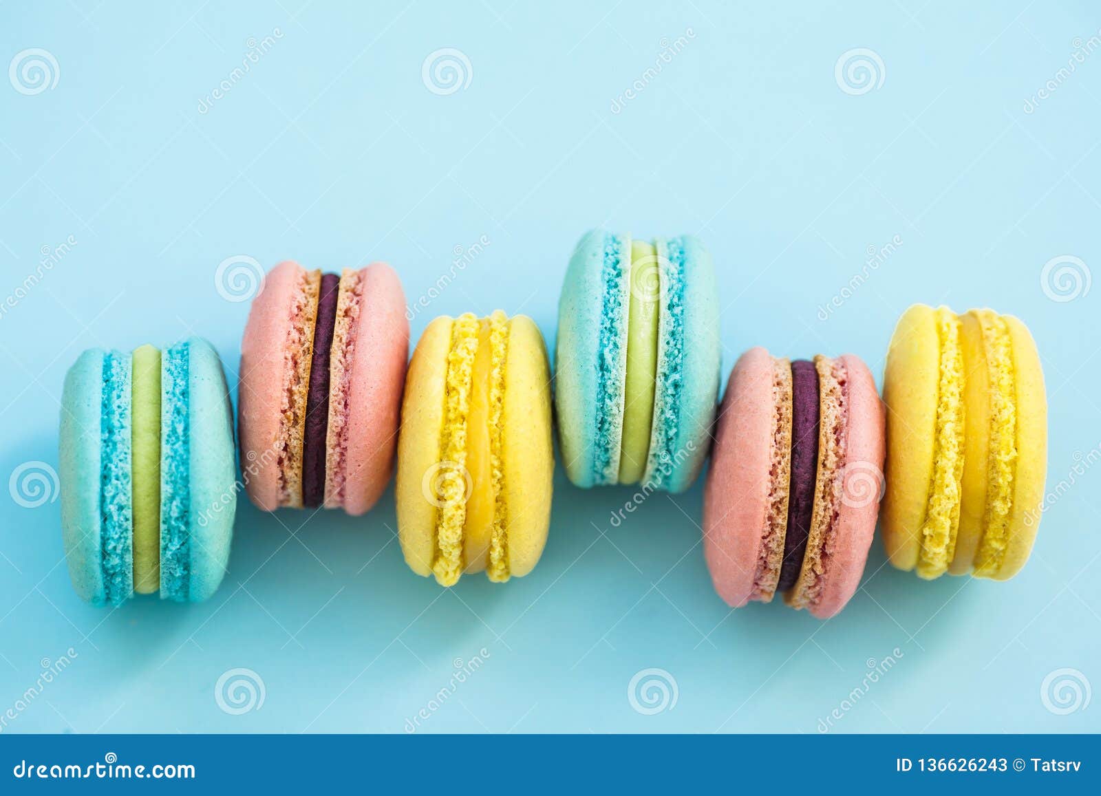 Sweet Colorful French Macaroon Biscuits on Blue Pastel Background, Top ...