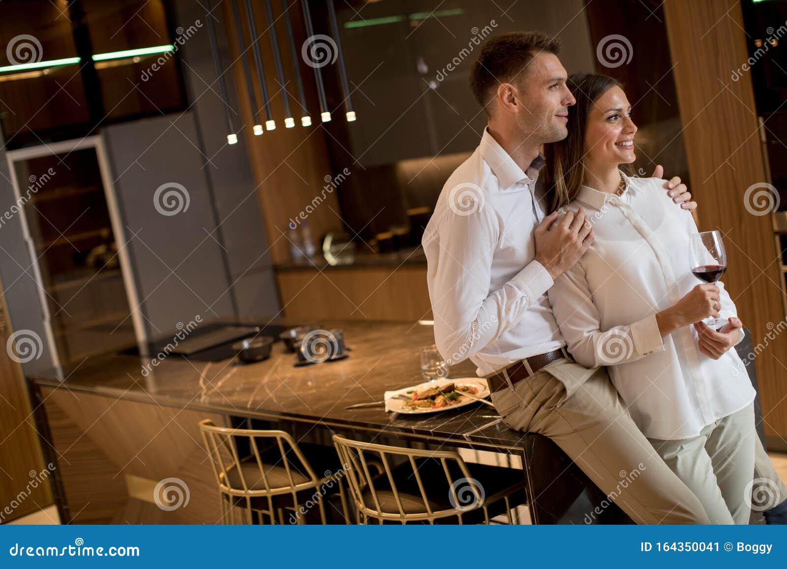 Sweet Couple Having Drinking Red Wine after a Romantic Dinner at Luxury
