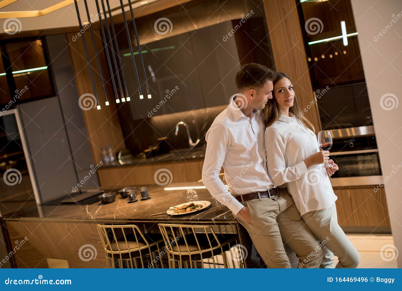 Sweet Couple Having Drinking Red Wine after a Romantic Dinner at Luxury
