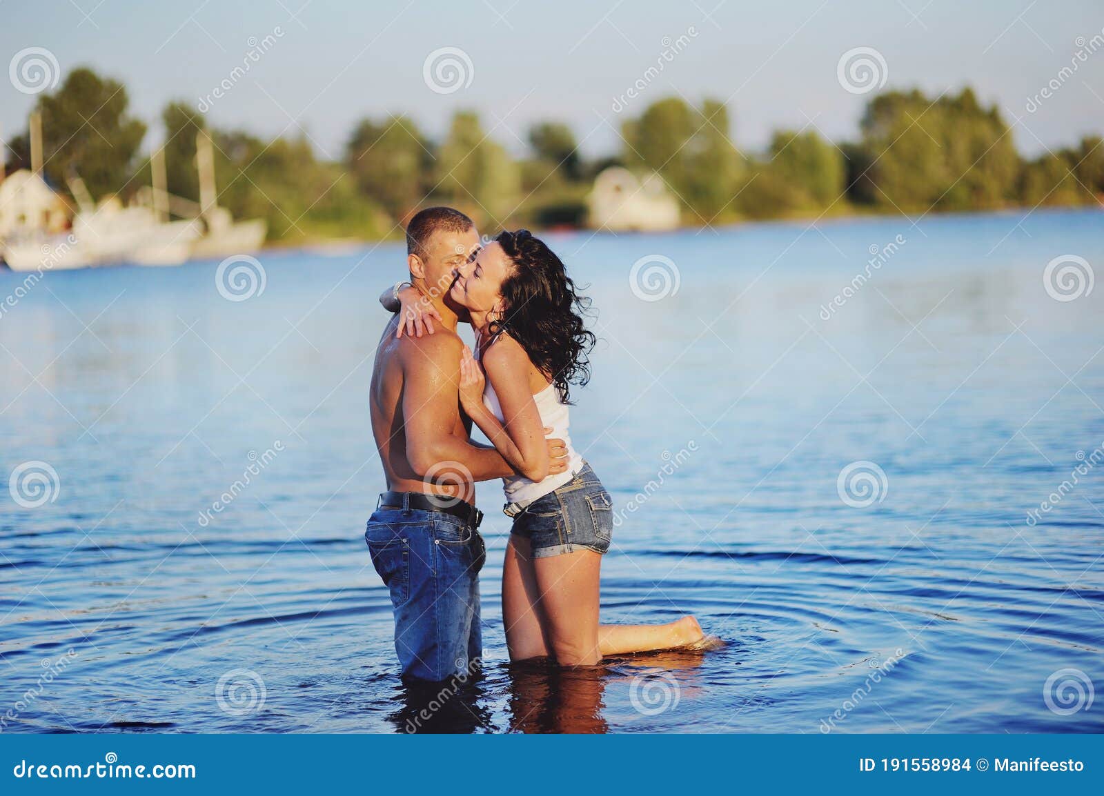 Sweet Couple in River during Sunset Having Fun Stock Photo - Image ...