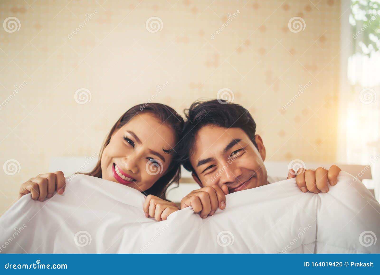 Sweet Couple Under the Blanket on the Bed Stock Photo Image of people, family 164019420
