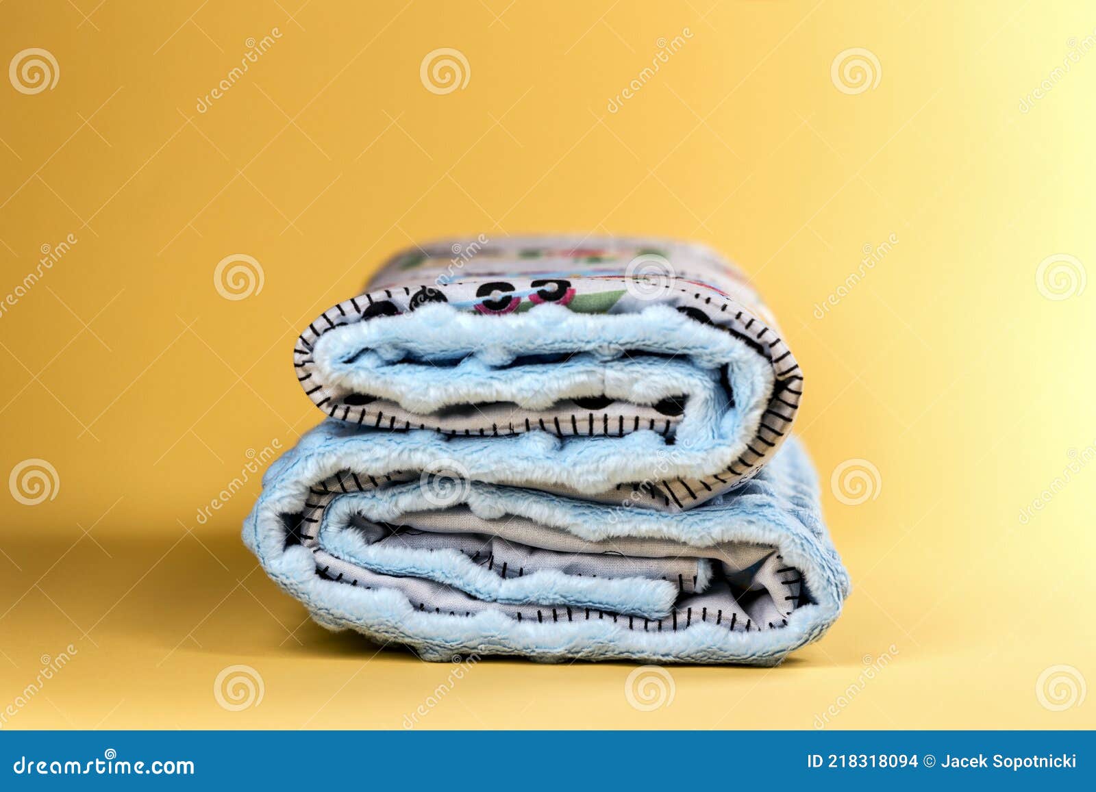 Sweet and Cute Baby Blanket with Pattern Isolated on Yellow Background