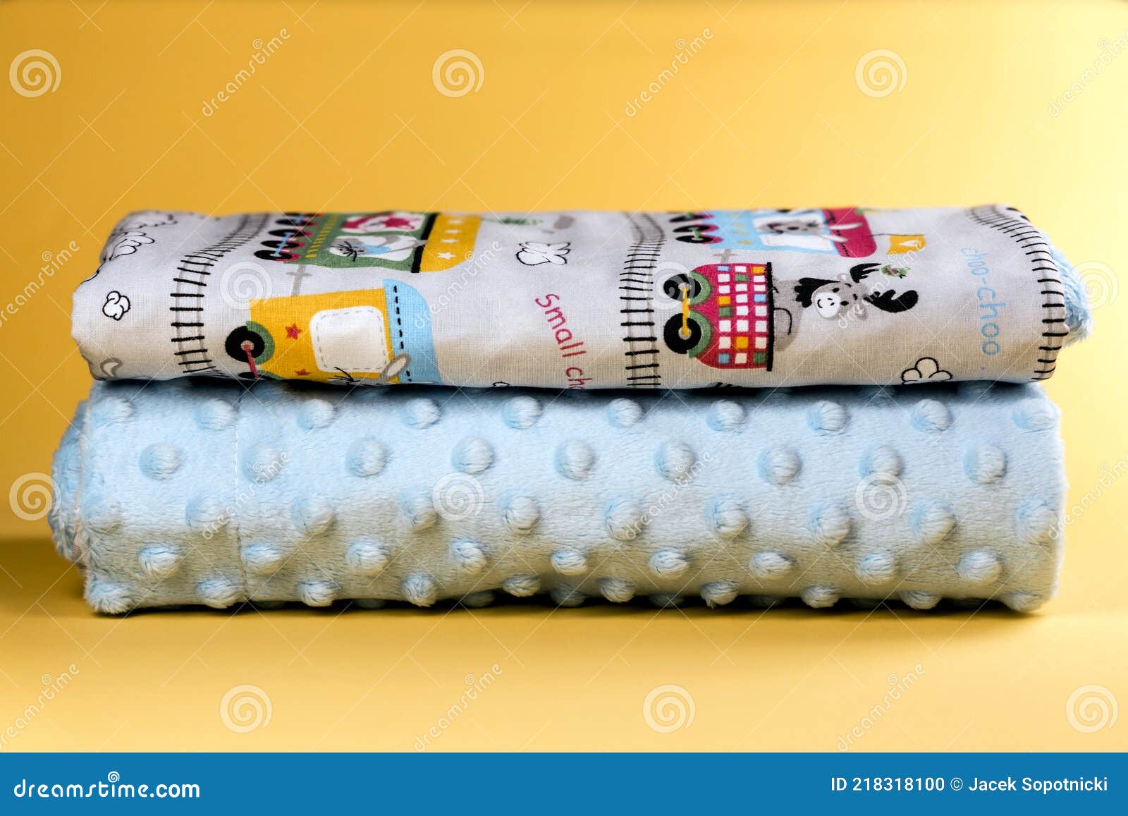 Sweet and Cute Baby Blanket with Train Pattern Isolated on Yellow Background Stock Photo Image