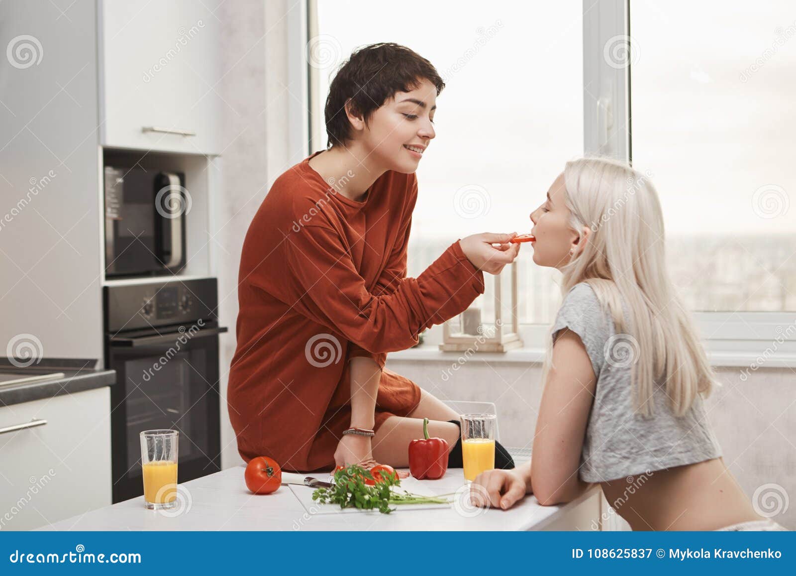 https://thumbs.dreamstime.com/z/sweet-cute-indoor-shot-hot-shirt-haired-woman-feeding-her-girlfriend-sitting-kitchen-table-preparing-women-108625837.jpg
