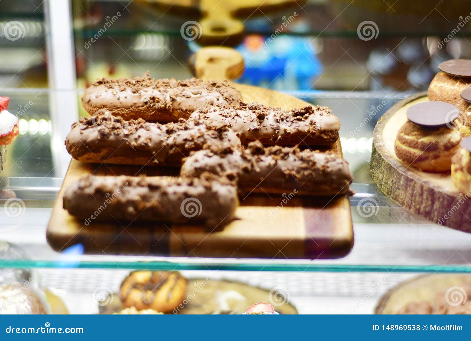 sweet desserts and cakes in a vitrine of a cafe
