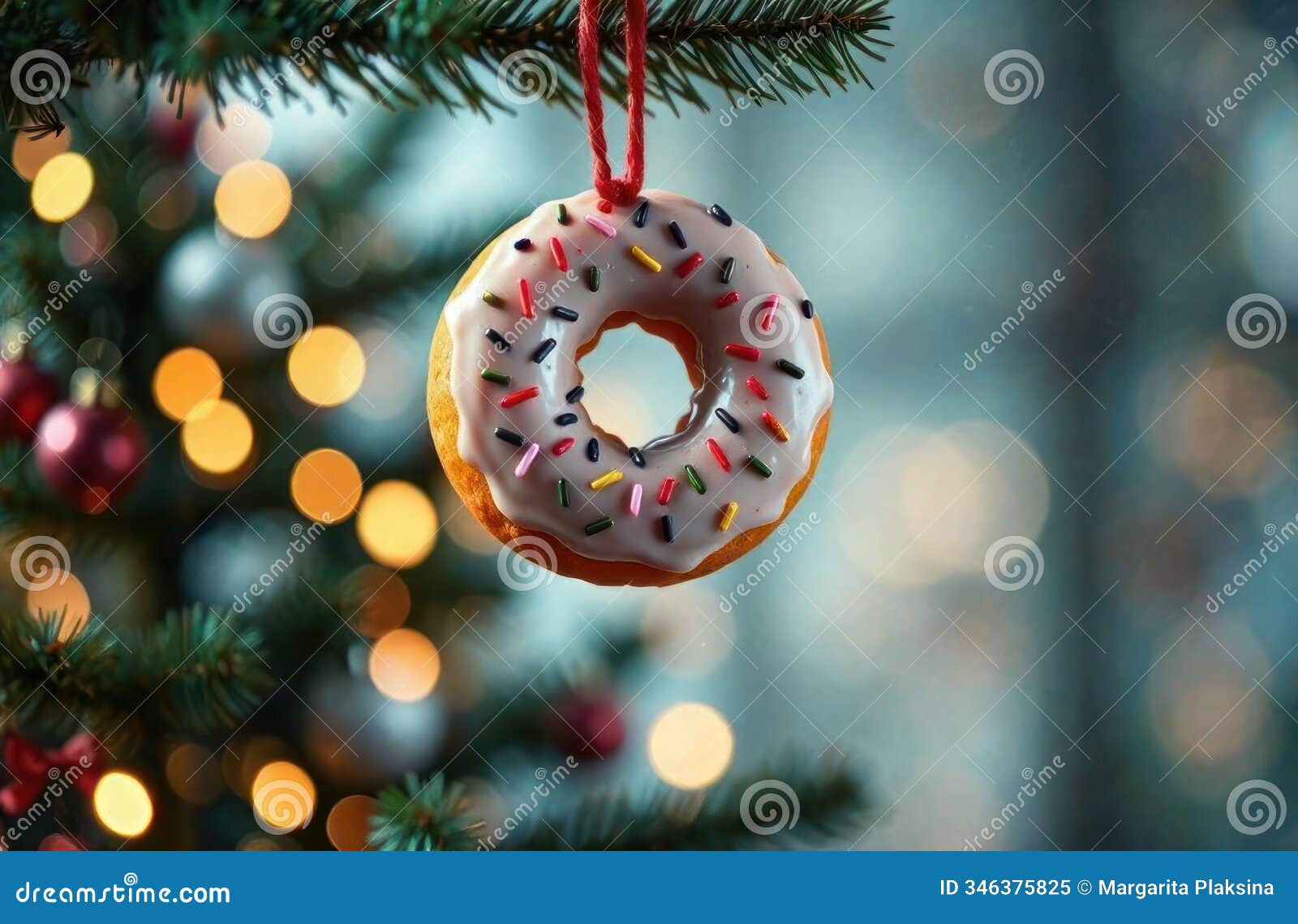 sweet donut christmas ornament hanging on a tree with sprinkles