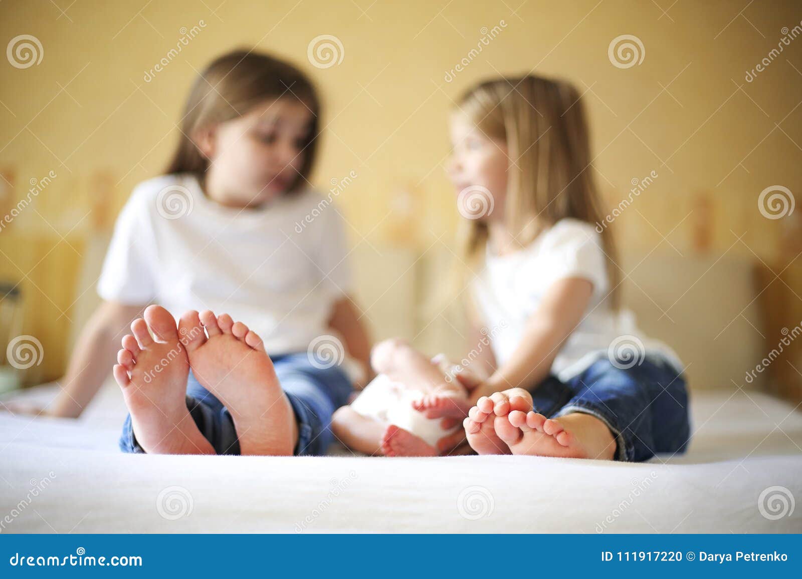 Sweet Family in Bed. Three Sisters, Close Up on Feet Stock Photo ...