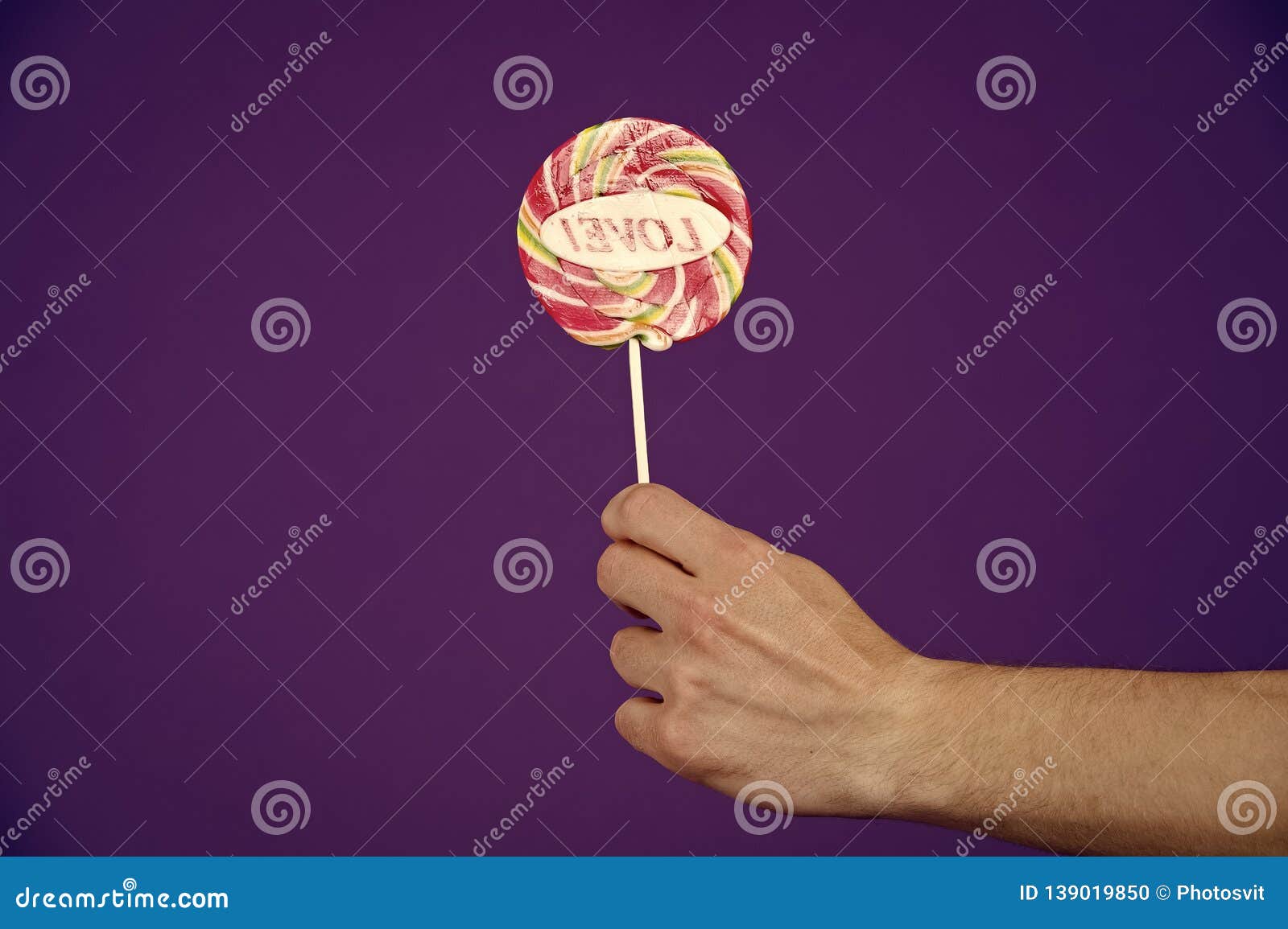 Sweet Feelings. Lollipop with Word Love. Male Hand Holds Lollipop with ...