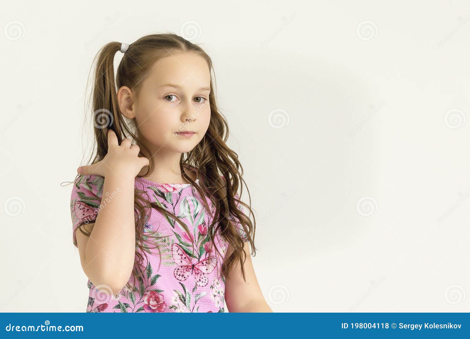 A Little Girl Fixes Her  Concept of Style and Fashion, Happy  People. Stock Photo - Image of comb, long: 198004118