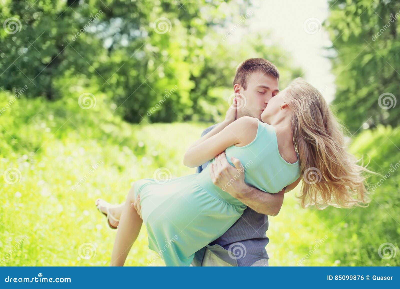 Sweet Kiss Young Couple Outdoors, Man and Woman in Love, he Holds ...