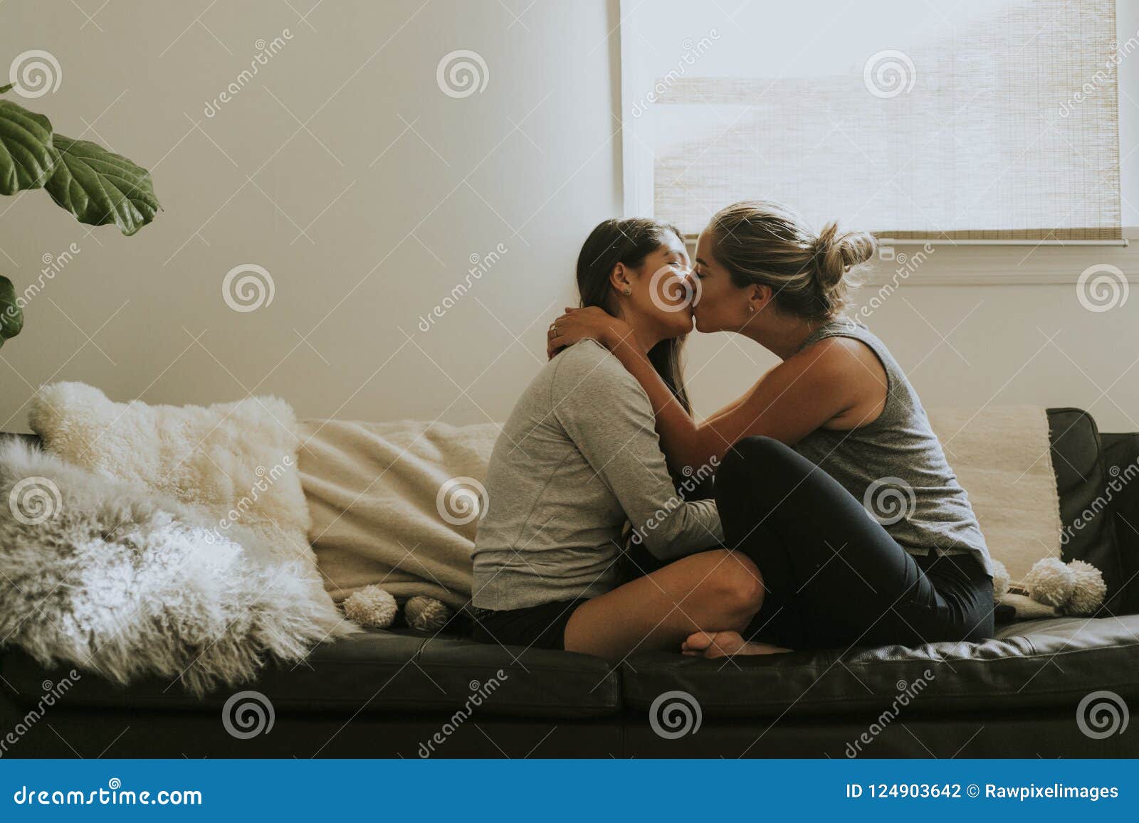 Lesbian Girls Kissing On The Sofa