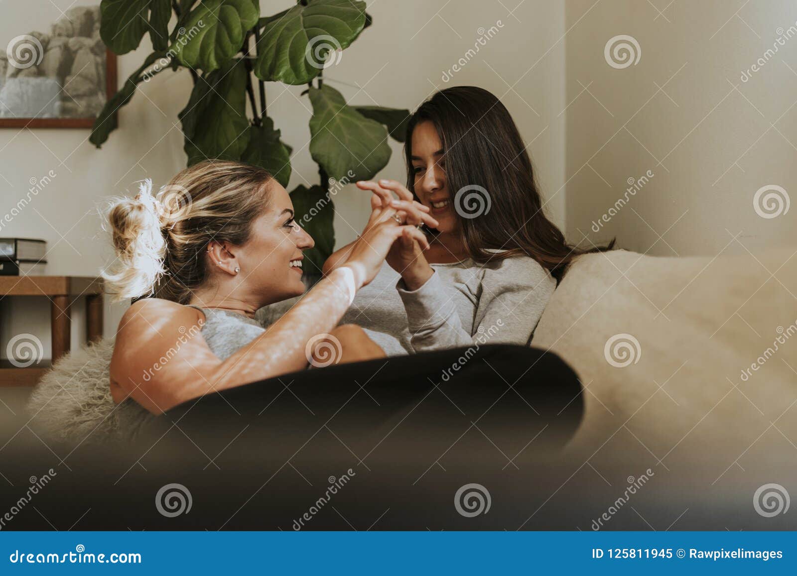 Lesbian Girls Kissing On The Sofa