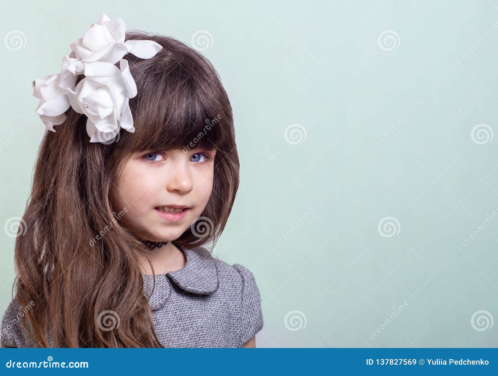 Sweet Little Girl with Curly Hair and White Flowers in Haircut. Cute  Stylish Child on Blue Background Stock Image - Image of face, fashion:  137827569
