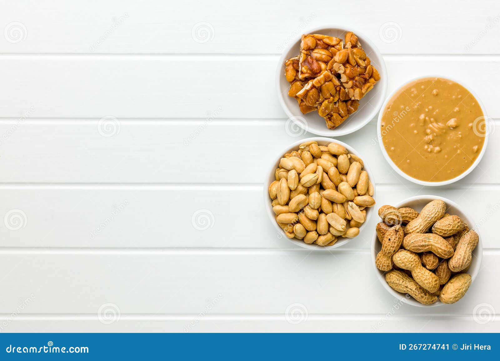 Sweet Peanut Brittle, Peanuts and Peanuts Butter on White Table. Top
