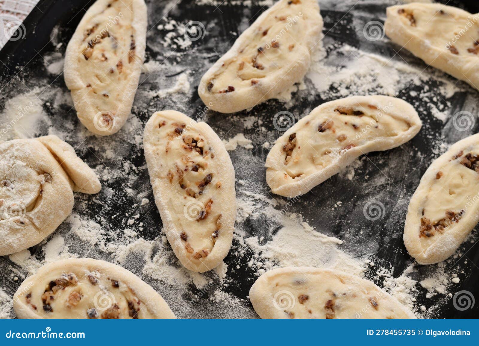 Sweet Rolls of Biscuit Dough with Nuts and Raisins Uncooked Stock Image