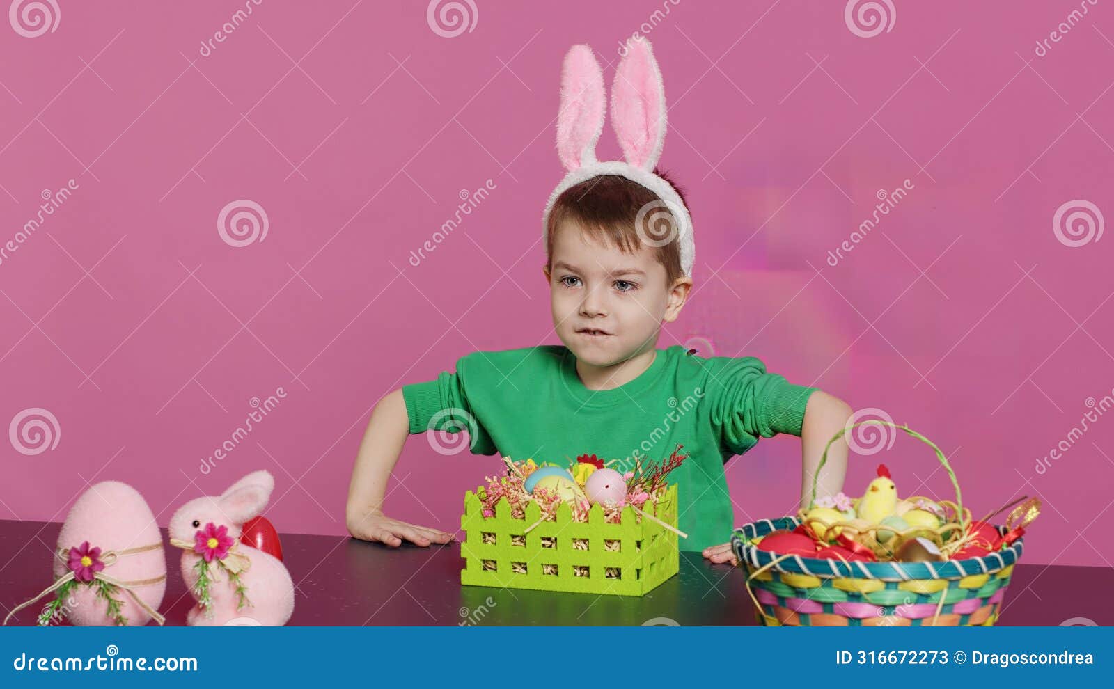 sweet young boy making colorful arrangements for easter holiday festivity