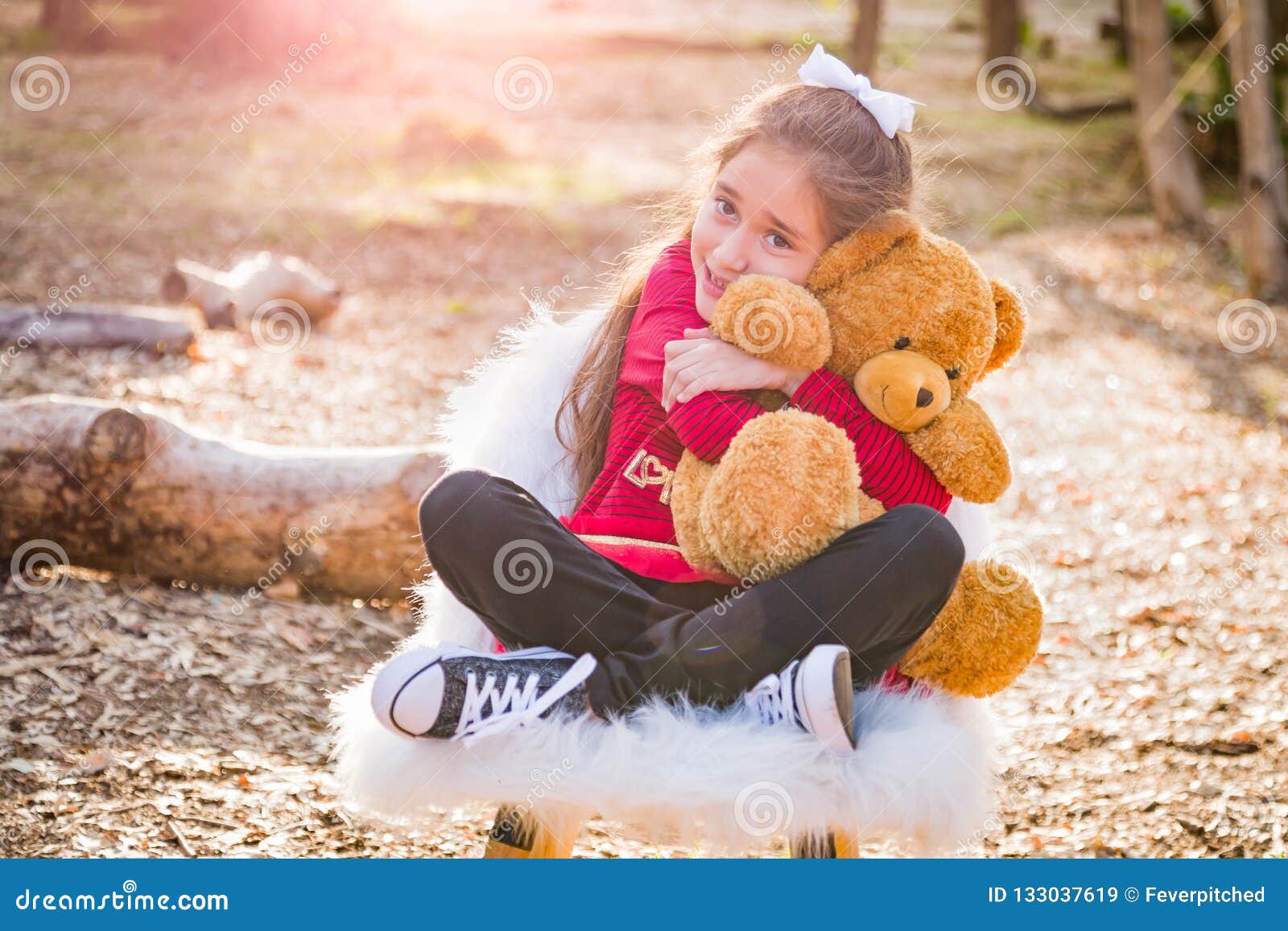 Girl Hugging Teddy Bear