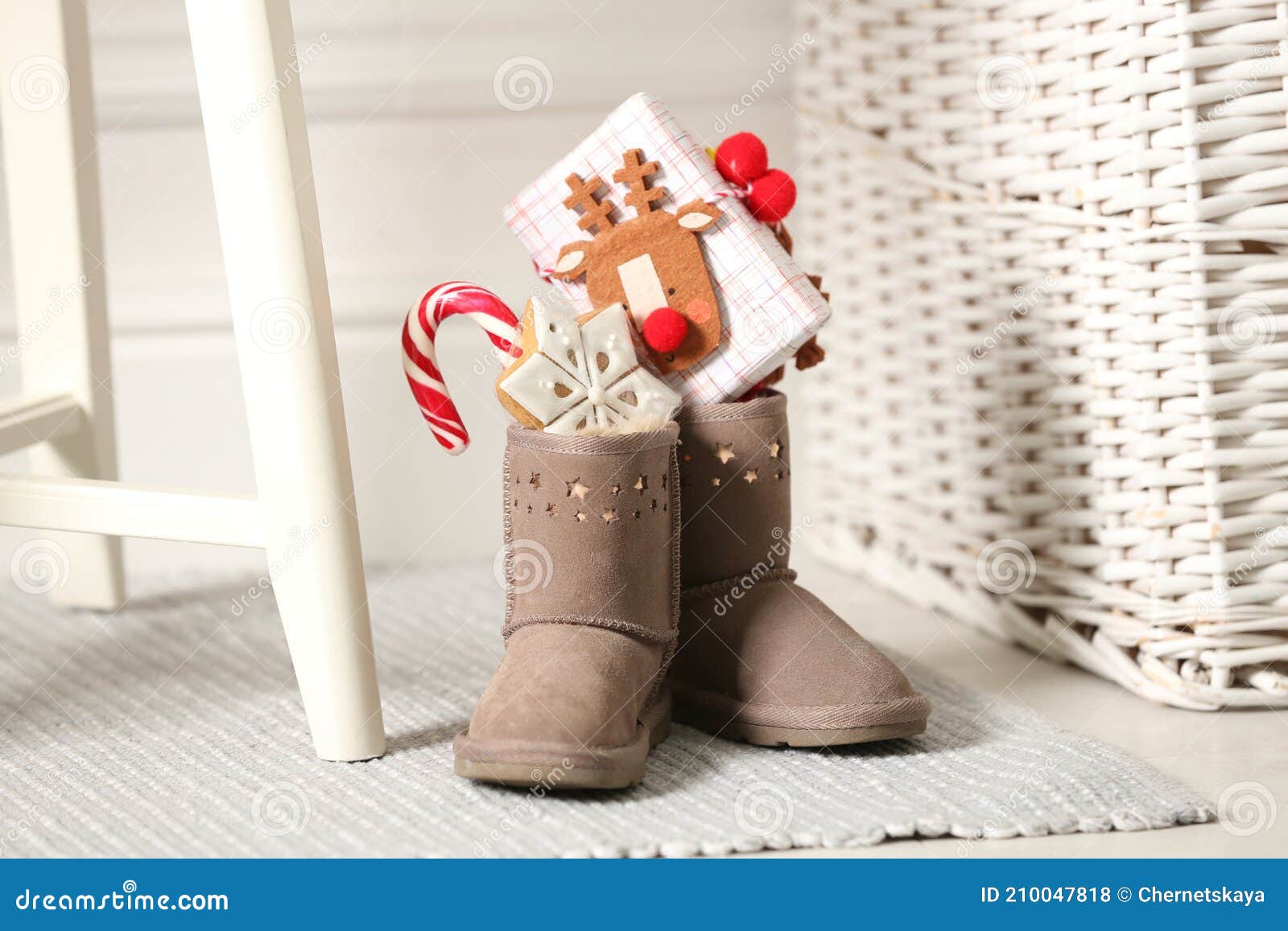 Chronicle weapon Stadium Sweets and Gift Box in Child`s Boots Indoors. St. Nicholas Day Tradition  Stock Photo - Image of background, seasonal: 210047818
