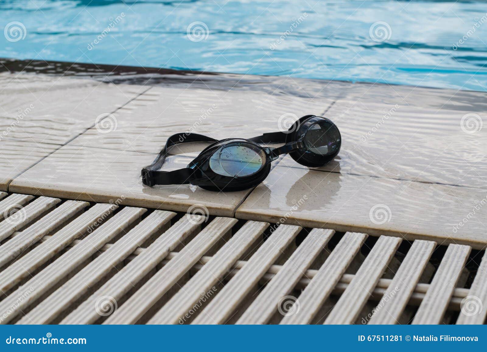 Swimming Goggles on the Edge of the Pool Stock Image Image of colored