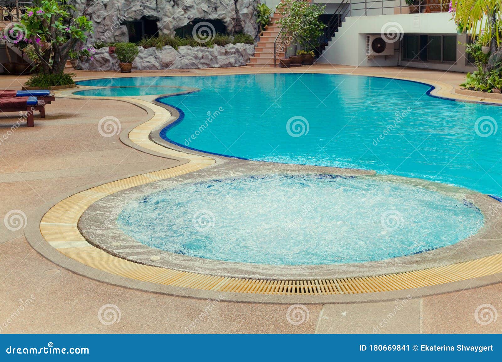 Swimming pool with jacuzzi stock image. Image of sinuous 180669841
