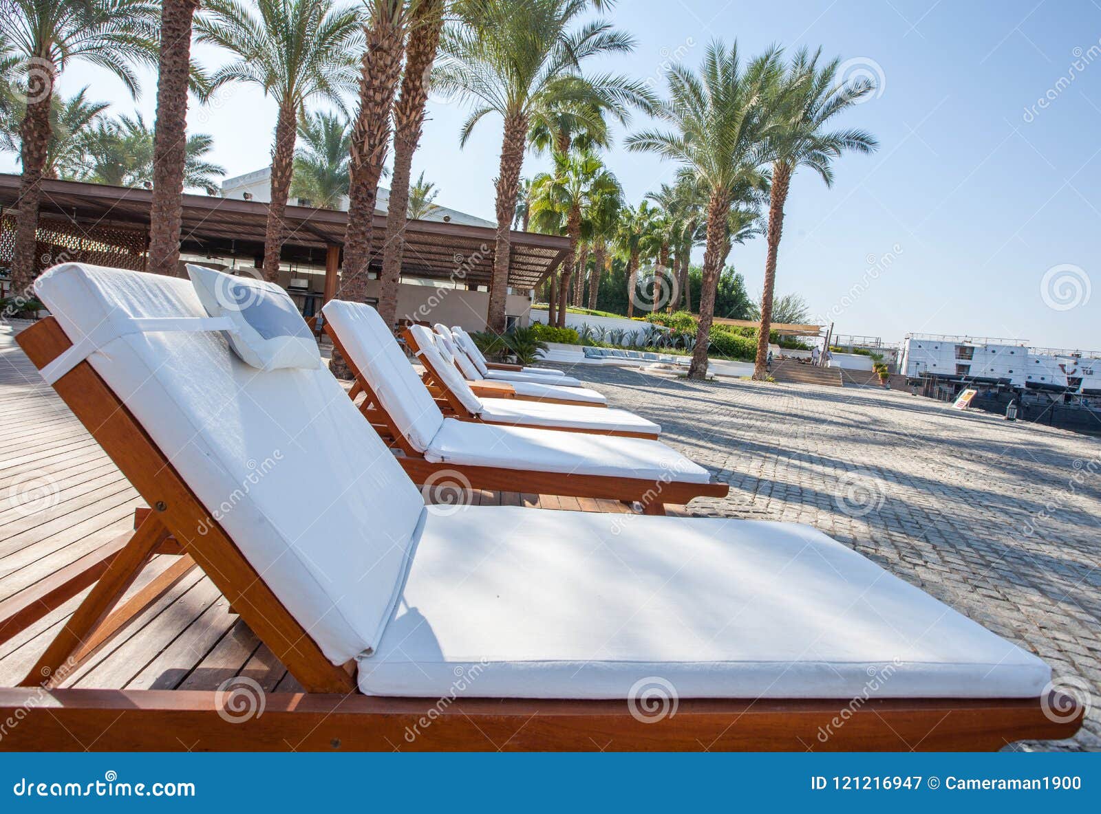 Swimming pool relax chairs stock image. Image of pool 121216947